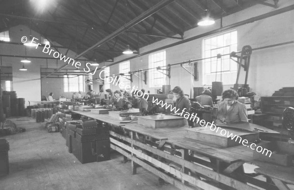 TRAVEL GOODS LTD IN FACTORY CUTTING FIBRE FOR SUITCASE FOLDING